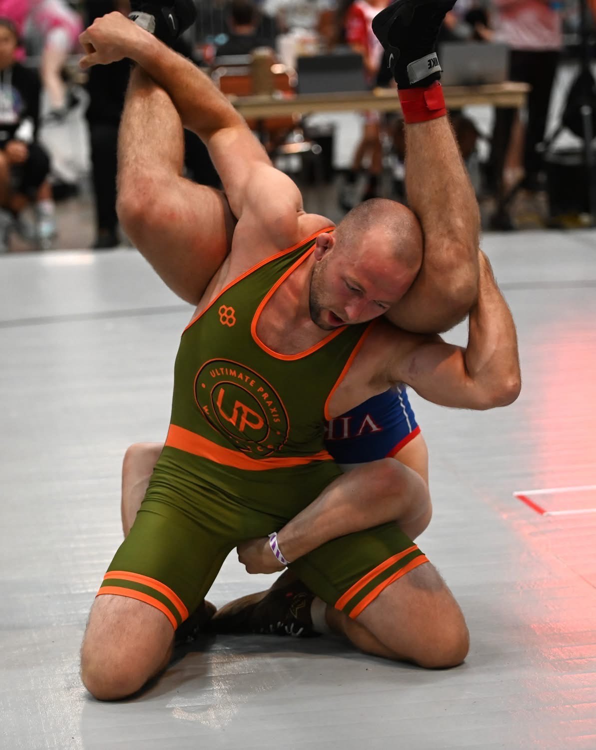 Brad Kerkhoff competing in Ultimate Praxis wrestling singlet